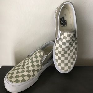 Vans checkered slip ons.